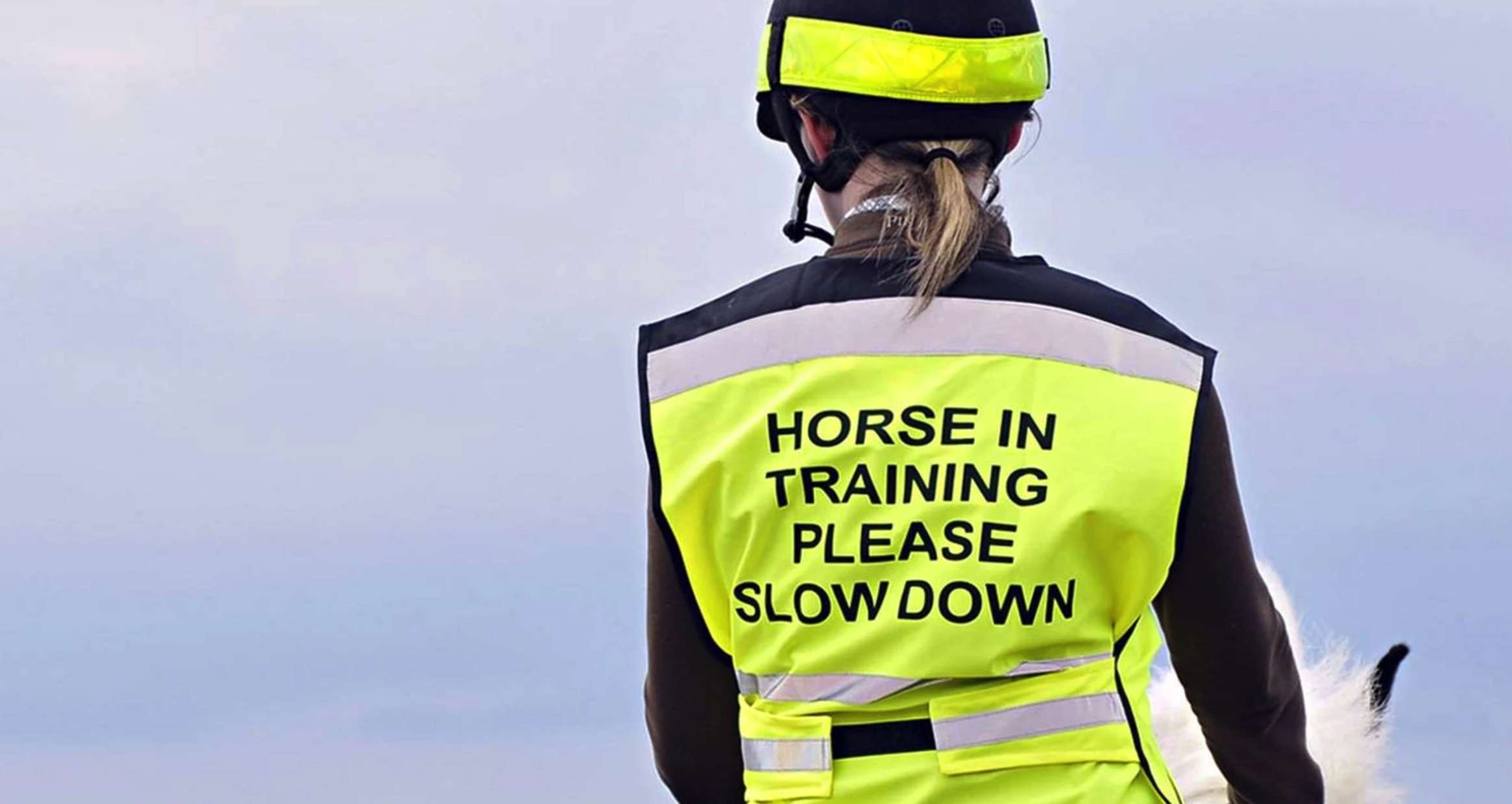 hi-viz gear on rider stating young horse in training