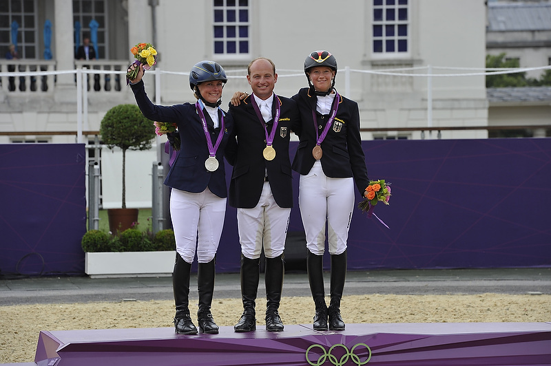 Gender equality: Germany’s Michael Jung took individual gold in Olympic Eventing at London 2012, with Sara Algottsson Ostholt (SWE) in silver and Sandra Auffarth (GER) in bronze. (FEI/Dirk Caremans)