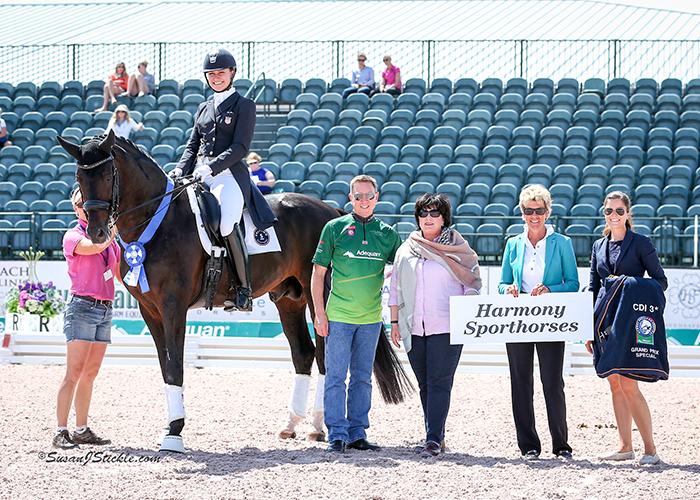Adrienne Lyle and Salvino in their winning presentation with Allyn Mann of Adequan®, Betsy Juliano, judge Ulrike Nivelle, and Cora Causemann of AGDF.