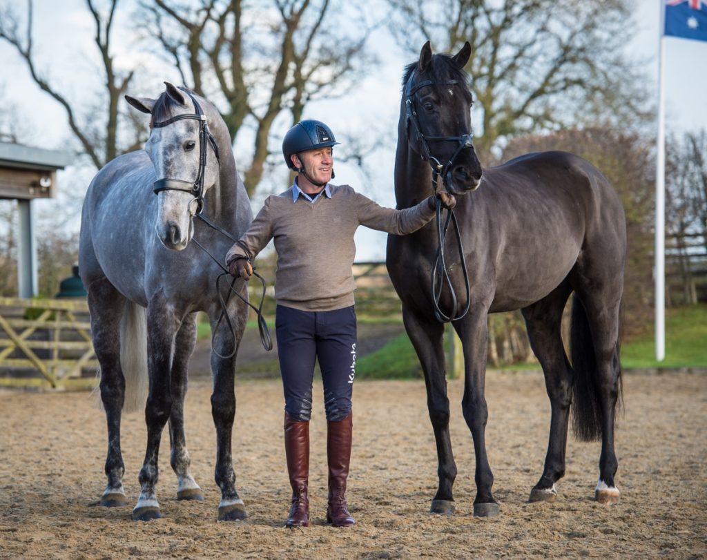 Andrew Hoy with two of his string: On the left seven-year-old gelding Brigant, by Caesar van de Helle and on the right four-year-old approved stallion OSO Monolitos, by Huzar.