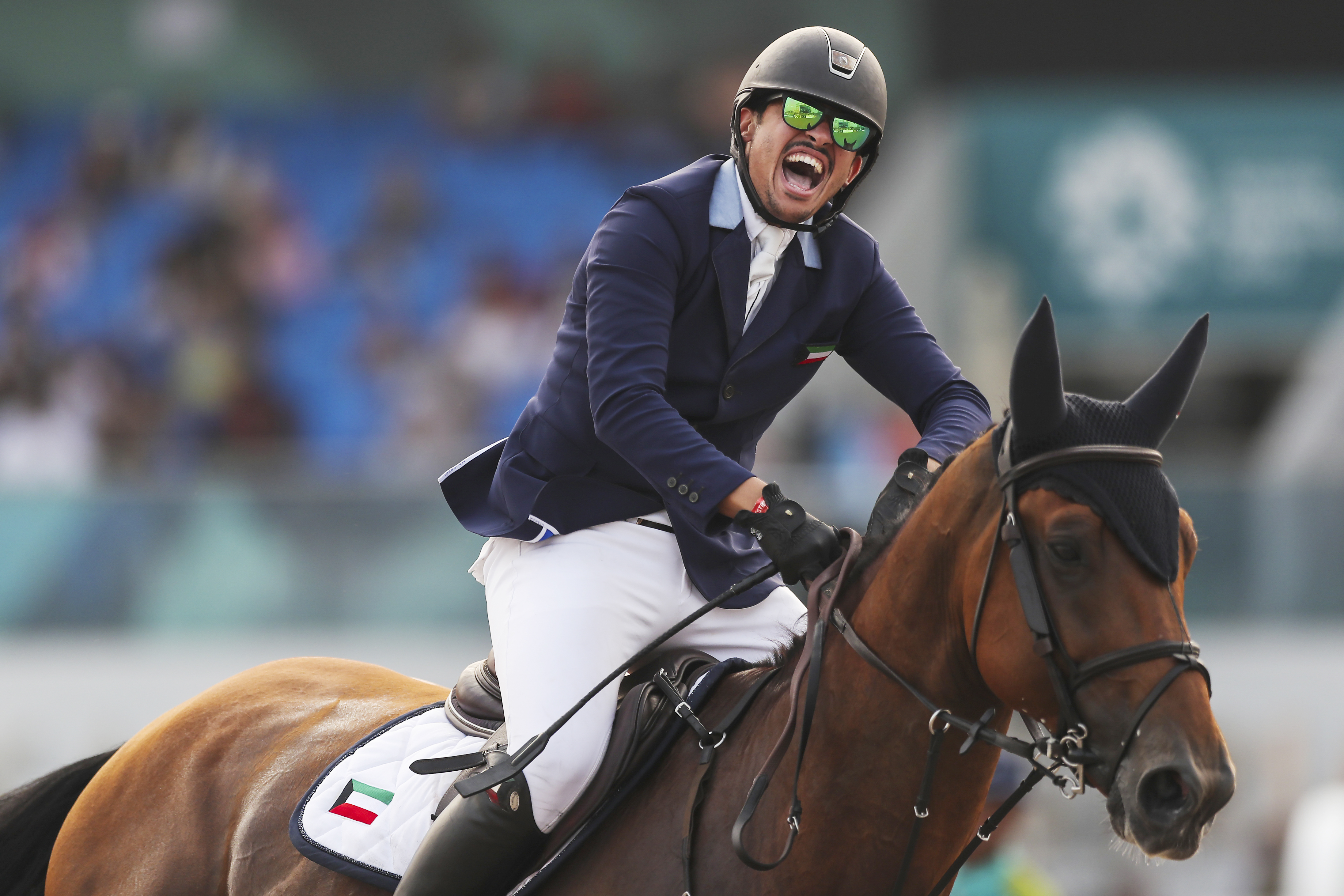 Talal Al Zahem of Kuwait, riding Cannonball Du Toultia Z, celebrates during the jumping event at the equestrian competition of the 18th Asian Games at Jakarta International Equestrian Park on August 28, 2018 in Jakarta, Indonesia. Photo FEI/Yong Teck Lim