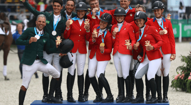 Eventing team medallists on the podium at the Pan American Games 2019 taking place at the Army Equitation School at La Molina in Lima, Peru today: L to R - Team Brazil (silver), Team USA (gold) and Team Canada (bronze). (FEI/Daniel Apuy/Getty Images)