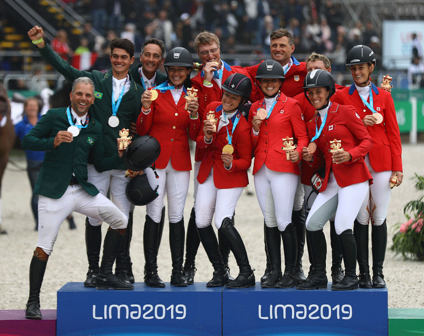 Eventing team medallists on the podium at the Pan American Games 2019 taking place at the Army Equitation School at La Molina in Lima, Peru today: L to R - Team Brazil (silver), Team USA (gold) and Team Canada (bronze). (FEI/Daniel Apuy/Getty Images)