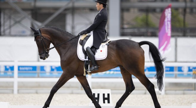 Japan’s Yoshiaki Oiwa riding Bart L JRA takes the early lead after today’s Dressage phase at the Ready Steady Tokyo test event. (FEI/Yusuke Nakanishi)``