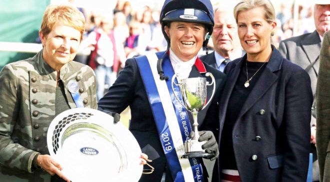 Pippa Funnell collecting the Land Rover Burghley Horse Trials Trophy. Image credit Mike Bain