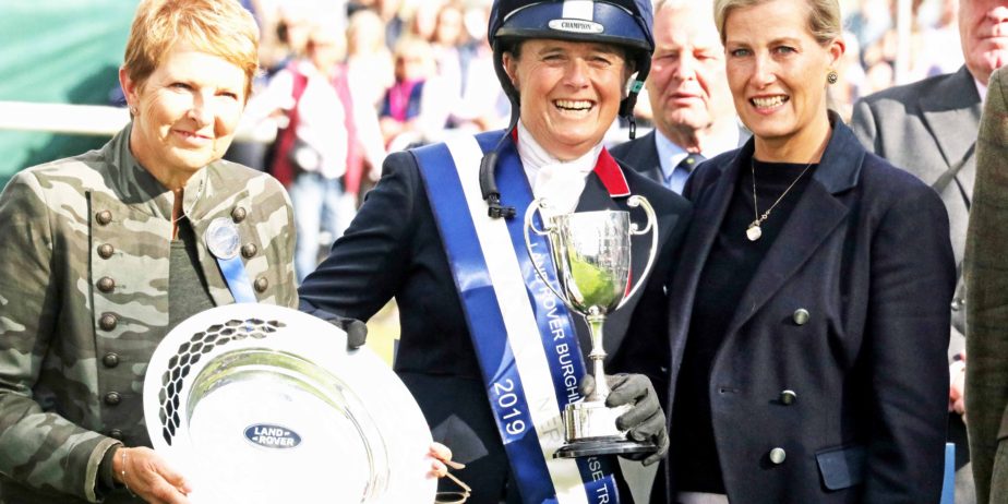 Pippa Funnell collecting the Land Rover Burghley Horse Trials Trophy. Image credit Mike Bain