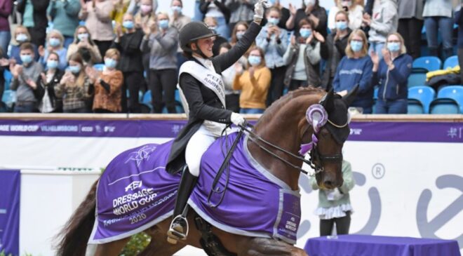 Denmark’s Cathrine Dufour and Bohemian salute the crowd after winning the first leg of the FEI Dressage World Cup™ 2020/2021 Western European League at the Danish National Equestrian Centre in Vilhelmsborg near Aarhus (DEN) today. (FEI/Ridehesten.com/Annette Boe Østergaard)