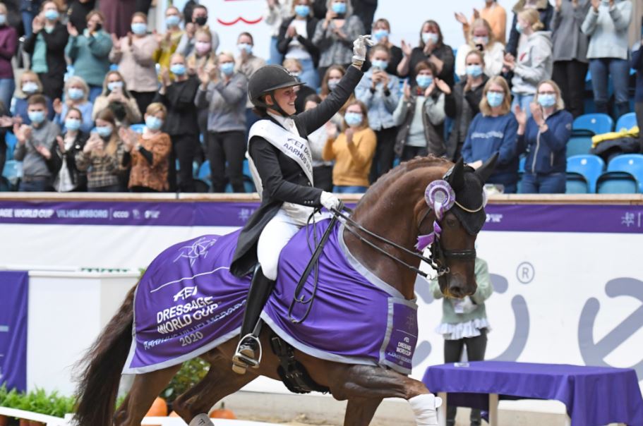Denmark’s Cathrine Dufour and Bohemian salute the crowd after winning the first leg of the FEI Dressage World Cup™ 2020/2021 Western European League at the Danish National Equestrian Centre in Vilhelmsborg near Aarhus (DEN) today. (FEI/Ridehesten.com/Annette Boe Østergaard)
