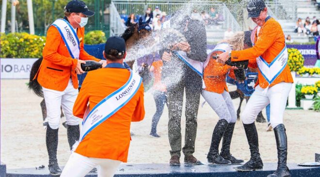 The Dutch team in celebration mood after their superb victory in the Longines FEI Jumping Nations Cup™ Final 2021 at the Real Club de Polo in Barcelona, Spain today. (FEI/Lukasz Kowalski)