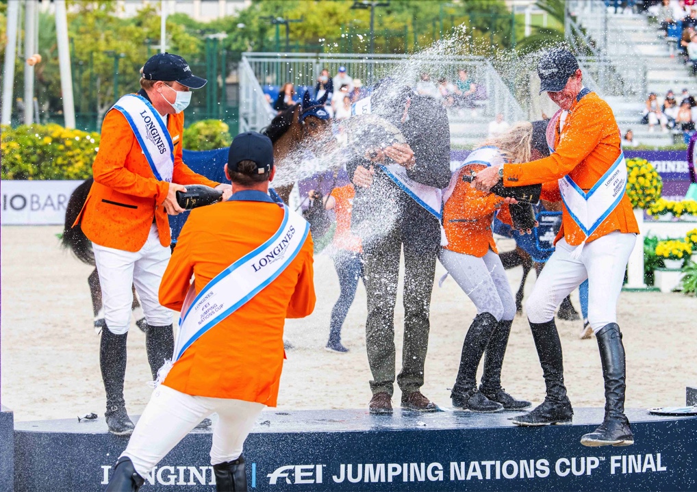 The Dutch team in celebration mood after their superb victory in the Longines FEI Jumping Nations Cup™ Final 2021 at the Real Club de Polo in Barcelona, Spain today. (FEI/Lukasz Kowalski)