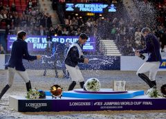 Switzerland’s Steve Guerdat (centre) celebrates in style with his compatriot and runner-up Martin Fuchs (left) and third-placed Peder Fredricson from Sweden (right) after victory at the Longines FEI Jumping World Cup™ Final 2019 at the Scandinavium Arena in Gothenburg (SWE). (FEI/Liz Gregg)