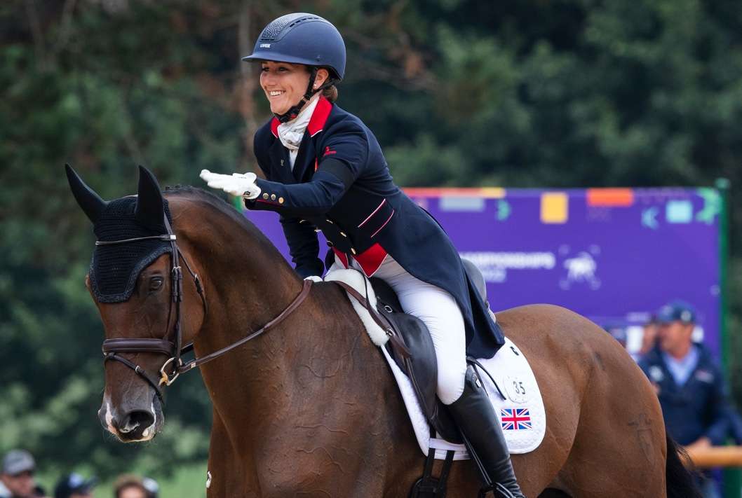 Laura Collett and London 52 in happy mood after taking the individual lead and putting Team Great Britain out in front after the first day of Dressage at the FEI Eventing World Championship 2022 at Pratoni del Vivaro, Rocca di Papa (ITA). (FEI/Richard Juilliart)