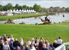 Badminton Horse Trials cross country course with horse and rider jumping over a fence