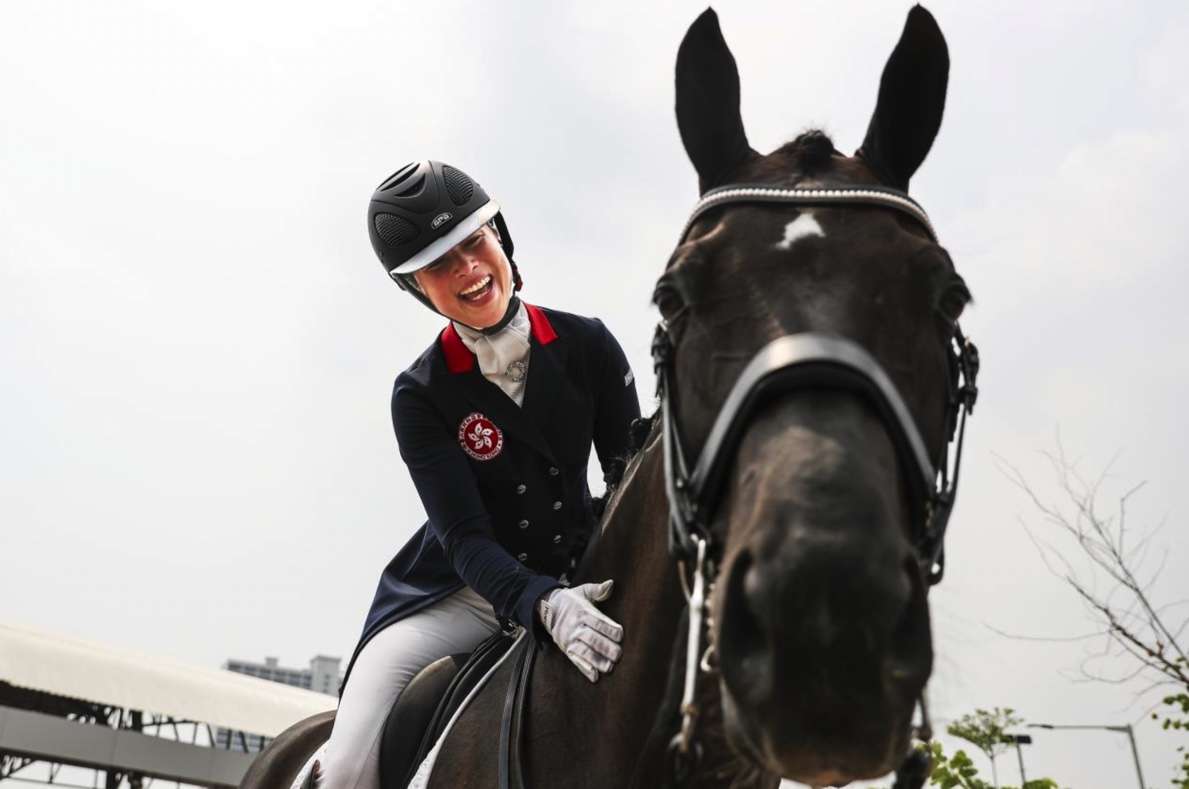 Jacqueline Siu of Hong Kong pats her horse JC Fuerst On Tour after winning the individual dressage event during the equestrian competition at the 18th Asian Games at Jakarta International Equestrian Park on August 23, 2018 in Jakarta, Indonesia. FEI/Yong Teck Lim