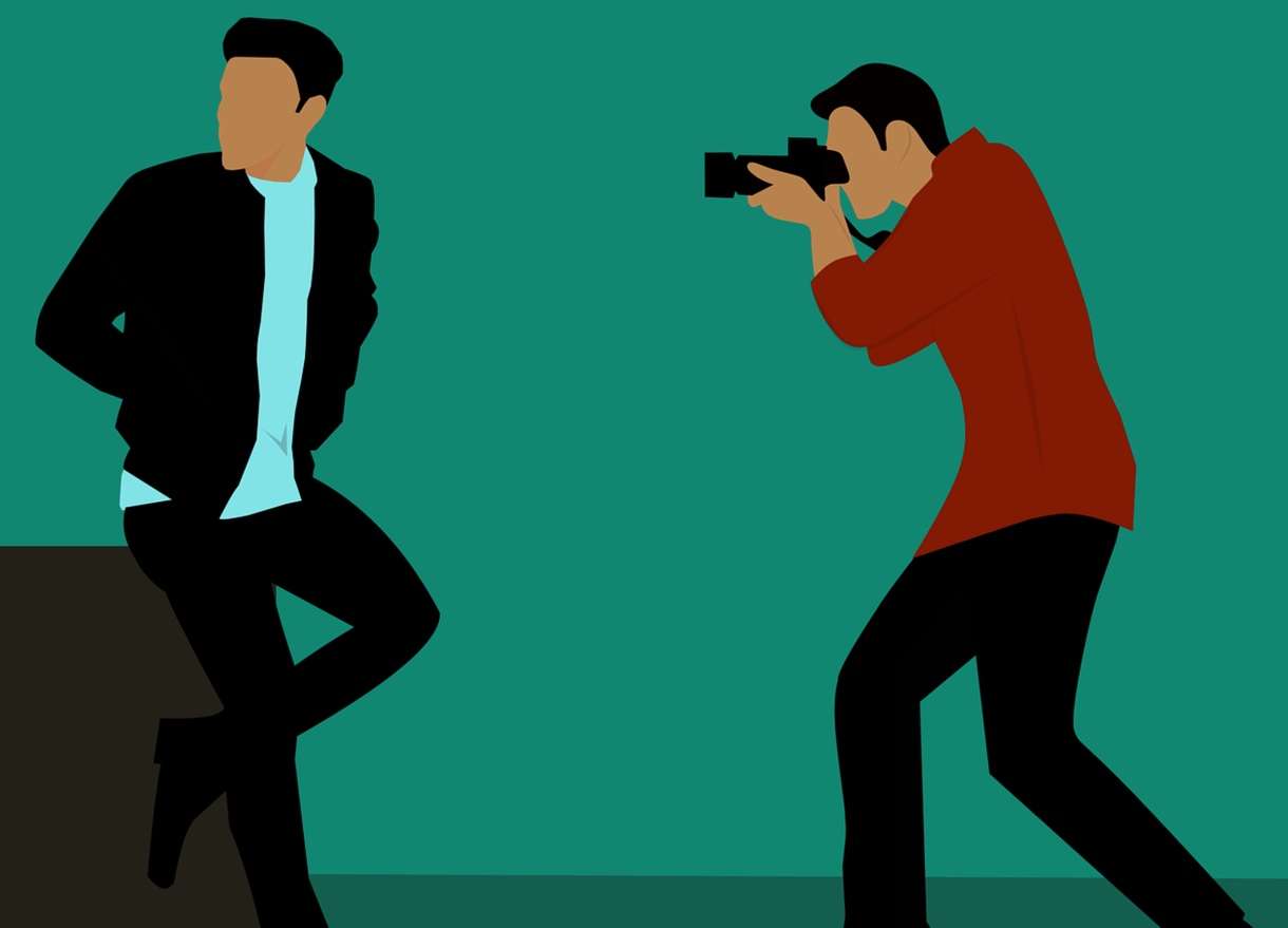 Photo Studio Near Me image of a man photographing another man - illustration