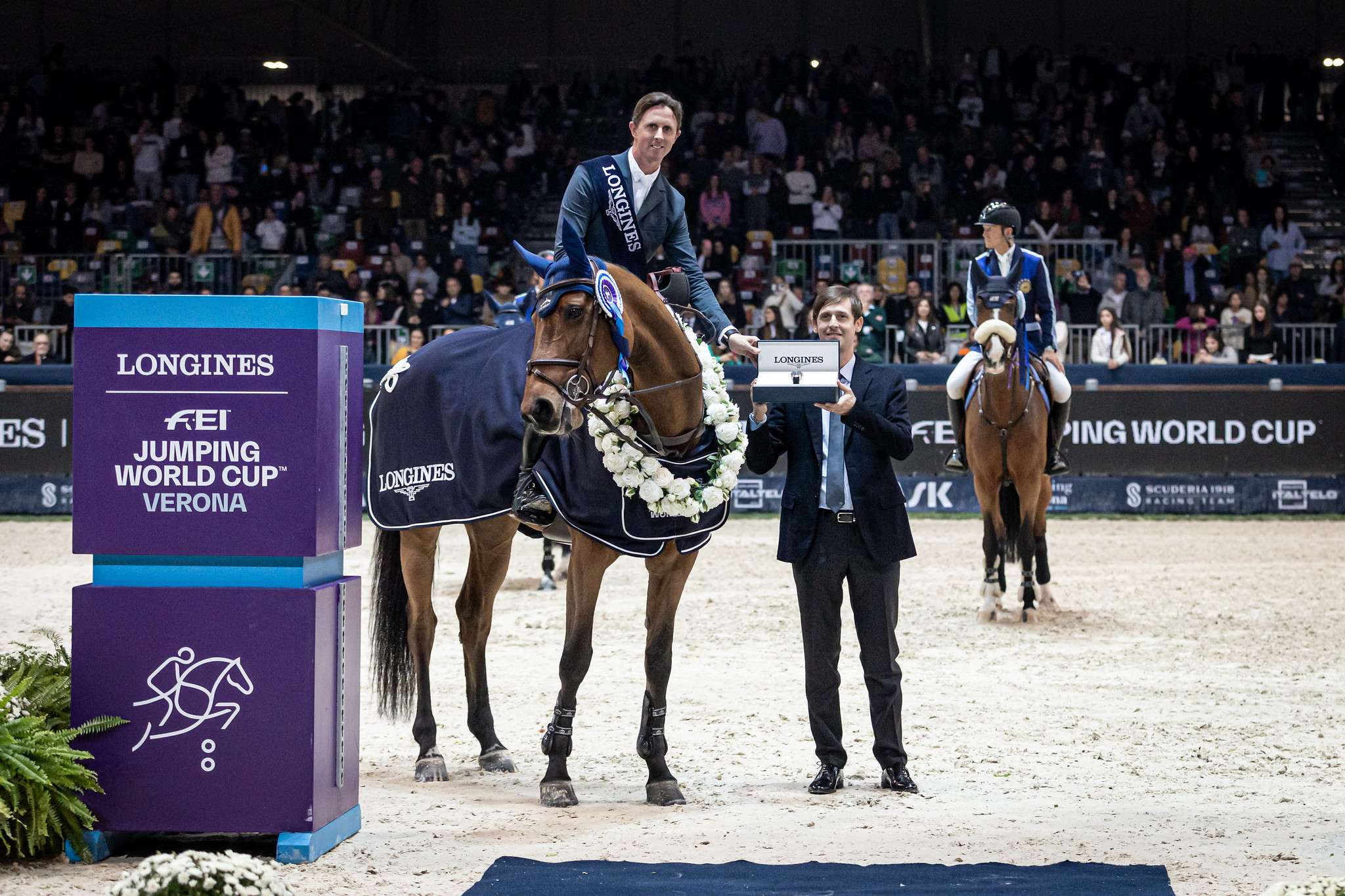Ben Maher (GBR) and Dallas Vegas Batilly, with Dr. Matteo Sovera at the prize ceremony. Longines FEI Jumping World Cup™ 2023/24 - Verona (ITA) Copyright ©FEI/Massimo Argenziano