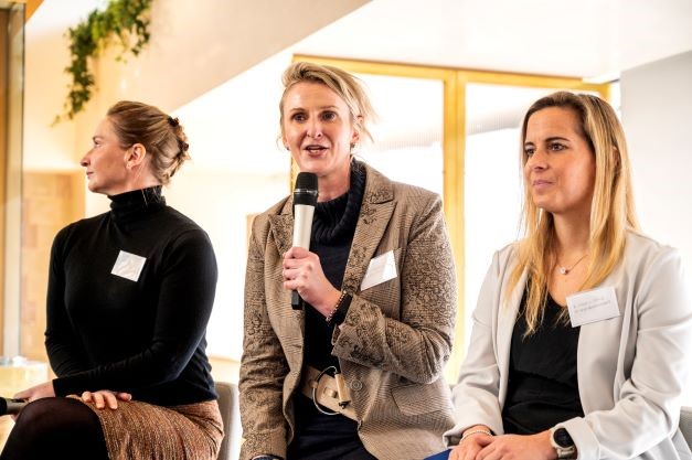 The Racing Together Industry Day will host questions and a panel of experts. image of three women sat on chairs addressing guests