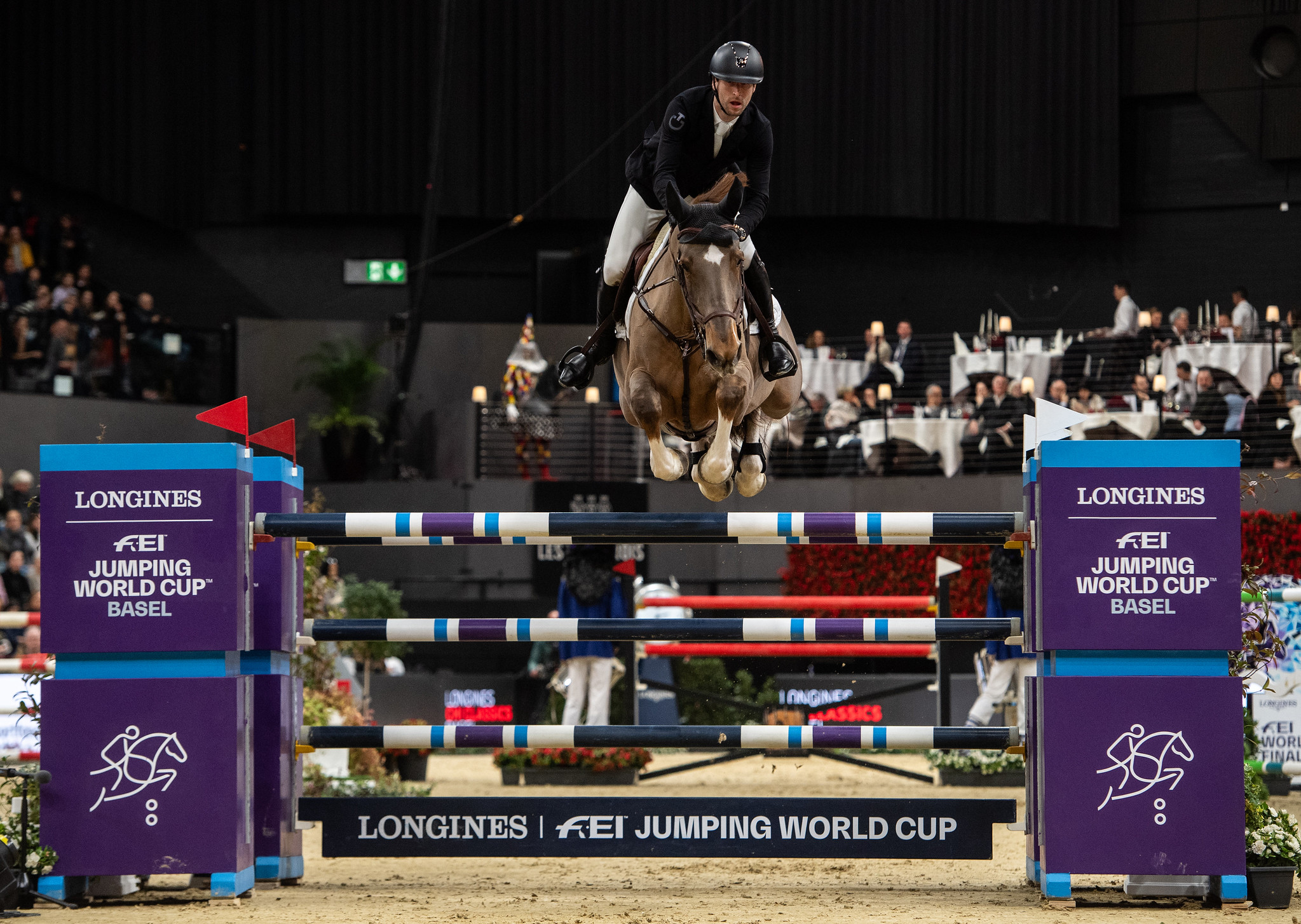 PIETER DEVOS of Belgium on MOM'S TOUPIE DE LA ROQUE tackles a jump in Longines FEI Jumping World Cup of Basel 2024 in Basel, Switzerland, January 14, 2024. Copyright © FEI/Martin Dokoupil