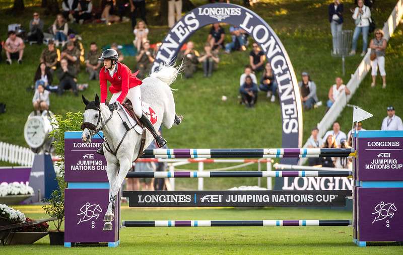 Longines FEI Jumping Nations Cup™ 2023 St. Gallen, Switzerland MARTIN FUCHS of Switzerland on LEONE JEI tackles a jump in a jump-off against Brazil on the way to win the Longines FEI Jumping Nations Cup of Switzerland in St. Gallen, Switzerland, June 2, 2023.