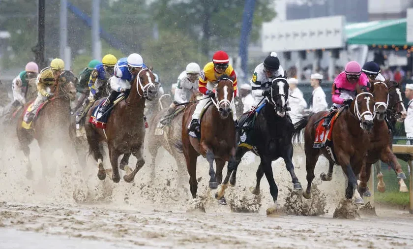 A Group Of Jockeys Racing In A Muddy Race Preakness Stakes