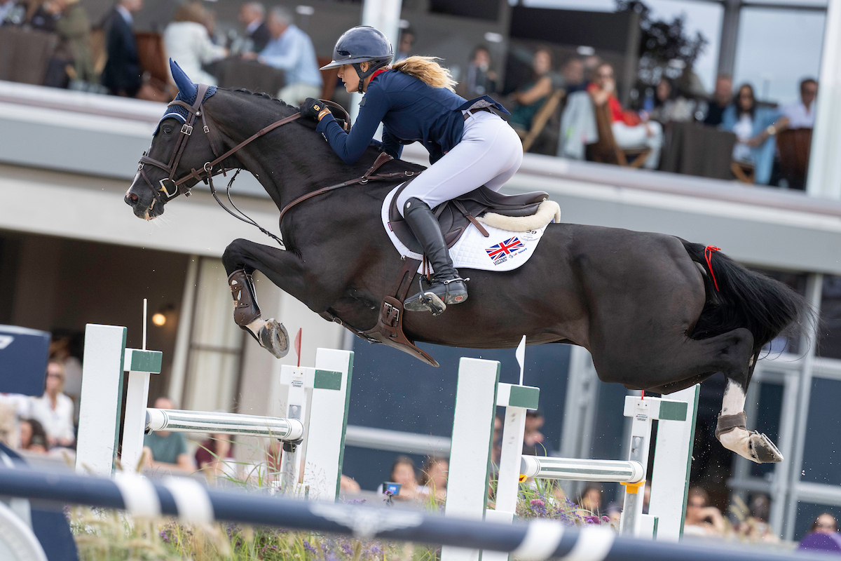 Jessica MENDOZA riding IN THE AIR over a fence at the Longines FEI Jumping European Championship 2025 - Casas Novas, A Coruña, Galicia, Spain - 18 July 2025 - photo Jon Stroud Media
