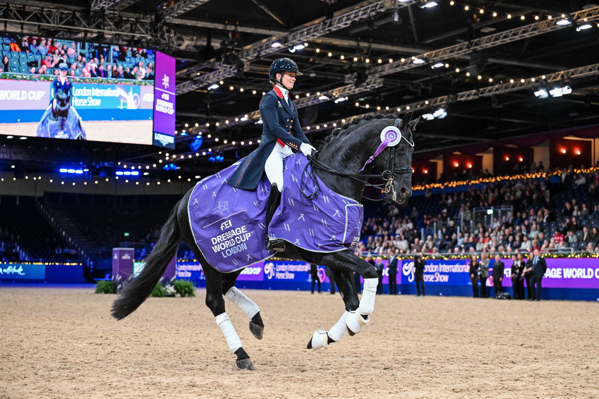 Charlotte Fry and Glamourdale, lap of honor in the FEI Dressage World Cup™ Grand Prix supported by Horse and Hound. Credit London International Horse Show/Peter Nixon