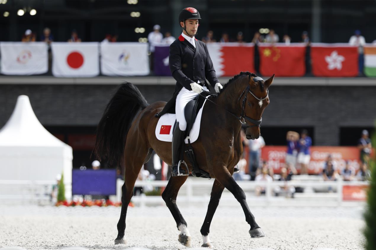 Alex Hua Tian (CHN) and Manjushri compete during the Eventing dressage competition at the Aichi-Nagoya 2026 Asian Games © Yusuke Nakanishi Photography