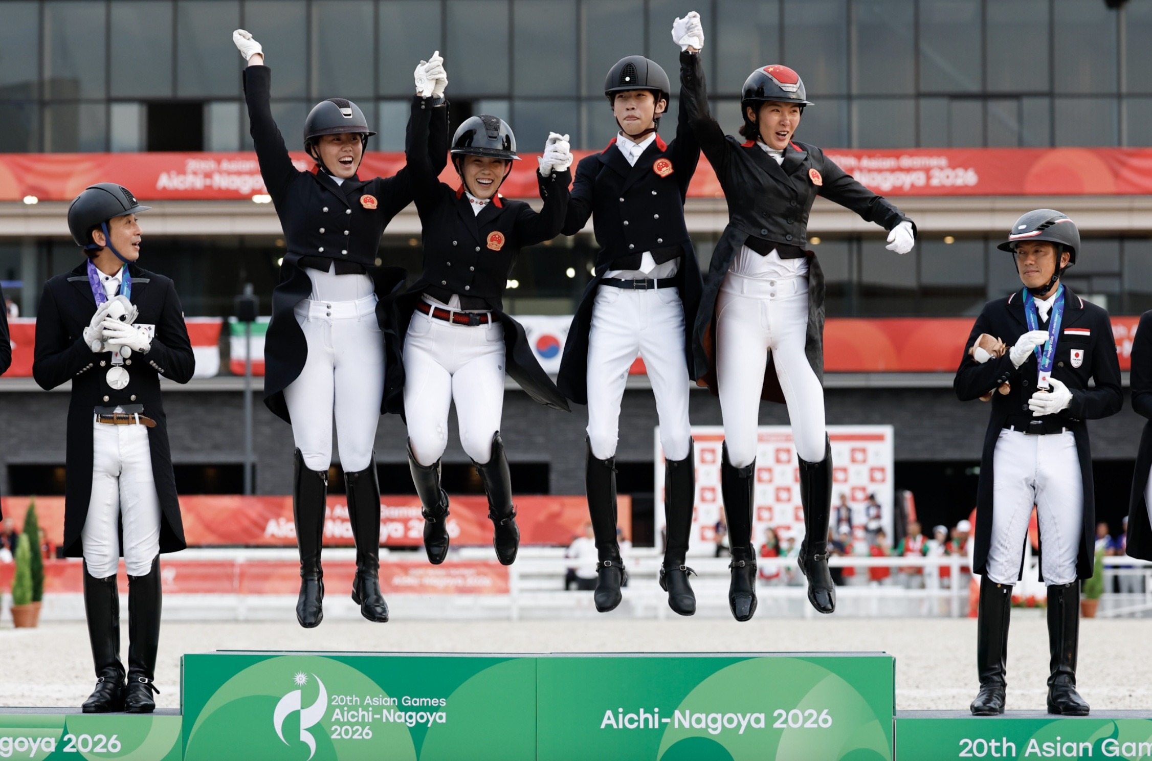 China celebrate winning Team Dressage gold at the Aichi-Nagoya 2026 Asian Games in Tokyo. © FEI / Yusuke Nakanishi