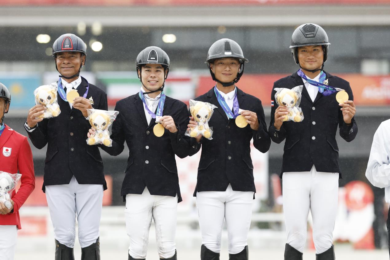 Gold medallists Thailand on the podium during the Eventing team medal ceremony of the 20th Asian Games Aichi-Nagoya 2026. © FEI / Yusuke Nakanishi Photography